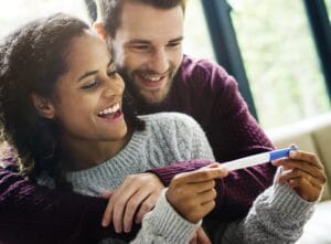 Happy couple with pregnancy news
