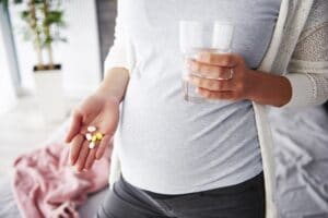 Pregnant woman taking medicines