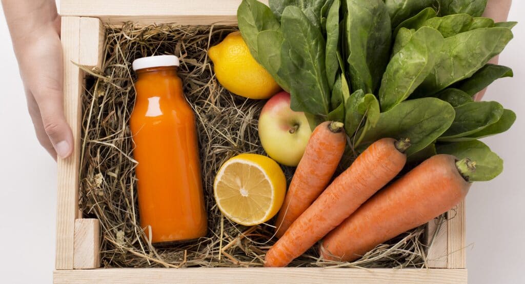 Assorted fruits and vegetables in wooden box for preparing detox smoothie